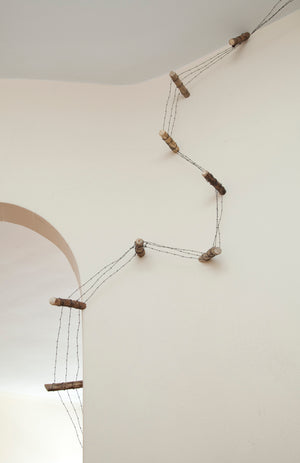 James Leonard - Running Fence no. 4 installation, in which a miniature barbed wire fence travels across walls, room to room