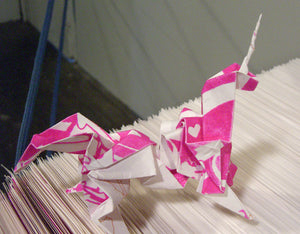 James Leonard - Detail of unicorn origami folds and flocked pink poster paper, Hungry Dust