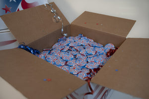 James Leonard - Detail of an open Hopeful box containing metal 2016 presidential campaign buttons