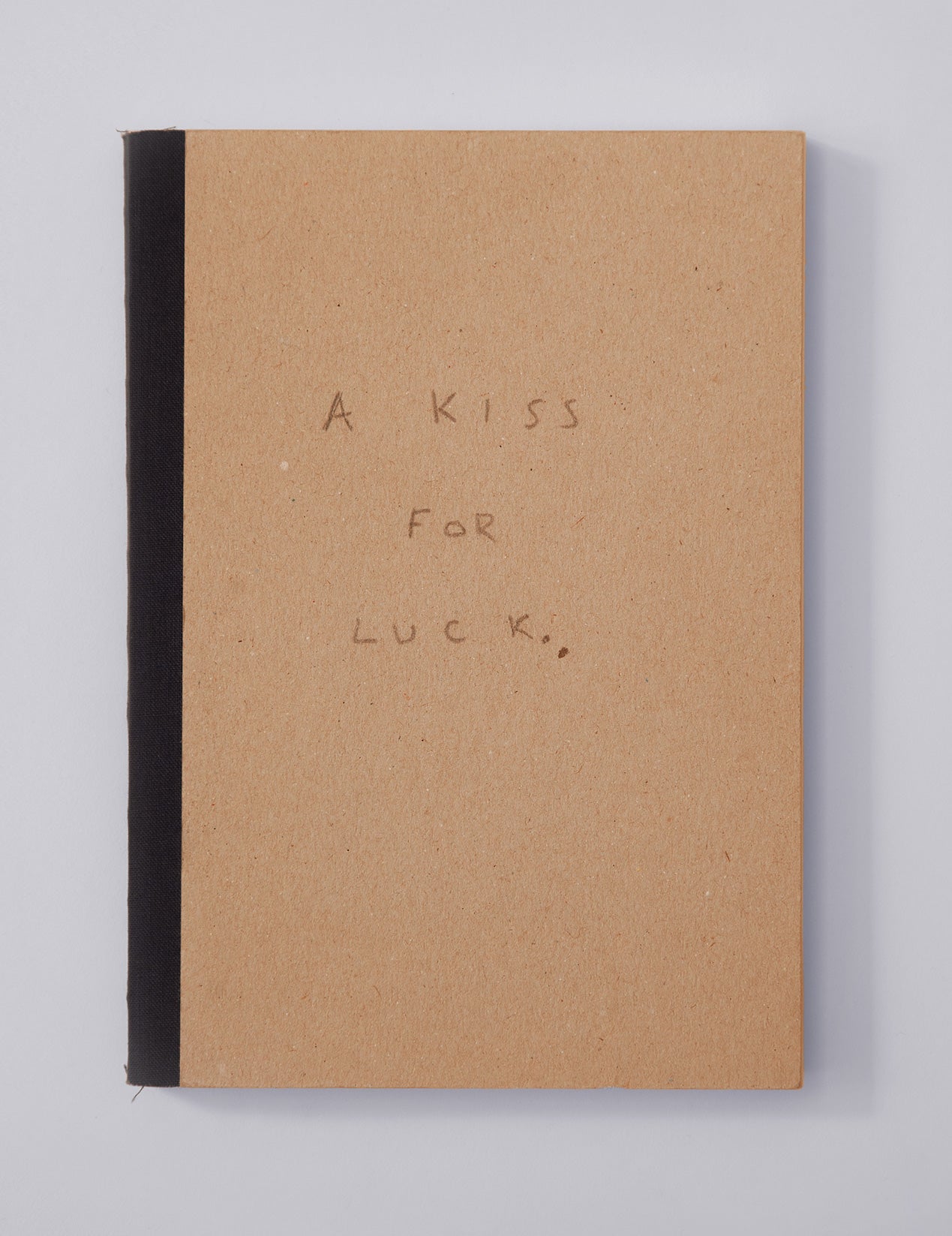 Cover of artist's journal-written in pencil: A Kiss For Luck