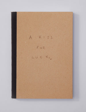 Cover of artist's journal-written in pencil: A Kiss For Luck