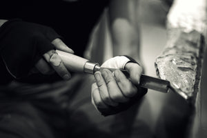 The hands of James Leonard carving during A Kiss For Luck 2013. Photo credit Wendy Whitesell.