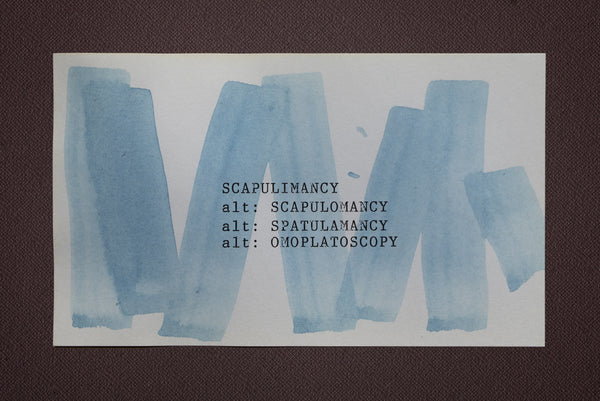 James Leonard - vertical blue watercolor brushstrokes on index card, with the word scapulimancy hand typed at the center 