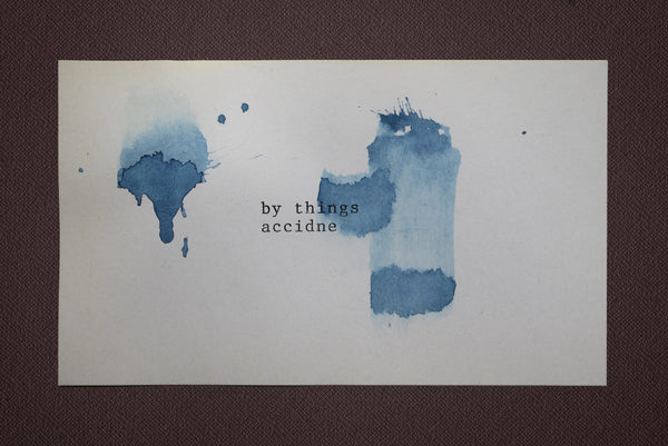 James Leonard - splotches of blue water color on index card; at the center reads by things accidne