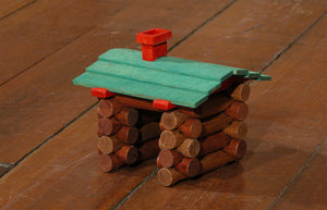 James Leonard - A side angle camera shot of Hovel, a miniature one room cabin made from Lincoln logs