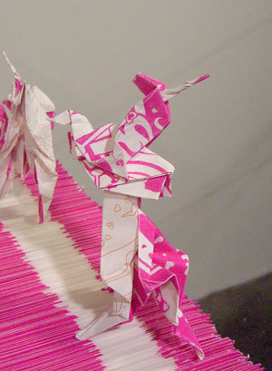 James Leonard - A close up image of a rearing origami unicorn, posed as part of the installation, Hungry Dust