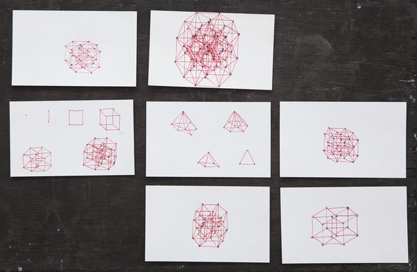 James Leonard - Image of seven white index cards with Hypercubes as Mandala drawings in red ink, ranging in complexity 