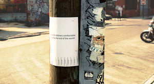 James Leonard - Seeking Diviners tear sheet art action as hung on telephone pole