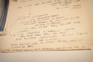 James Leonard - A close-up of a few notes on lined paper, explaining experience of being involved in the action, Mute. 