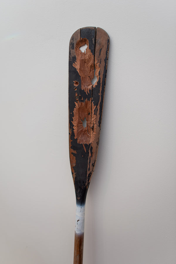 James Leonard - Untitled Oar no. 2, a black paddle with holes carved through it