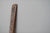 James Leonard - Side angle of sandblasted Untitled Oar no. 6; punctured holes of light are present in the paddle's shadow
