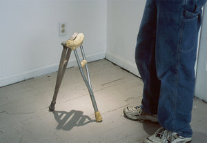 James Leonard - Size perspective image of Two Monkeys Cudgel; a man stands next to the artwork that come up to about knee-height 