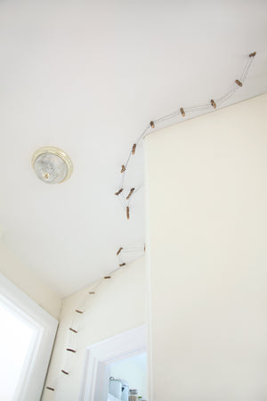 James Leonard - Running Fence no. 5 as installed in a NYC apartment; view looking upwards at the miniature fence that is attached to the ceiling
