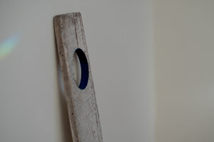 James Leonard - Side angle of Untitled Oar no. 8, showcasing the inner edges of the circular cut-out of the paddle painted in a deep cerulean blue