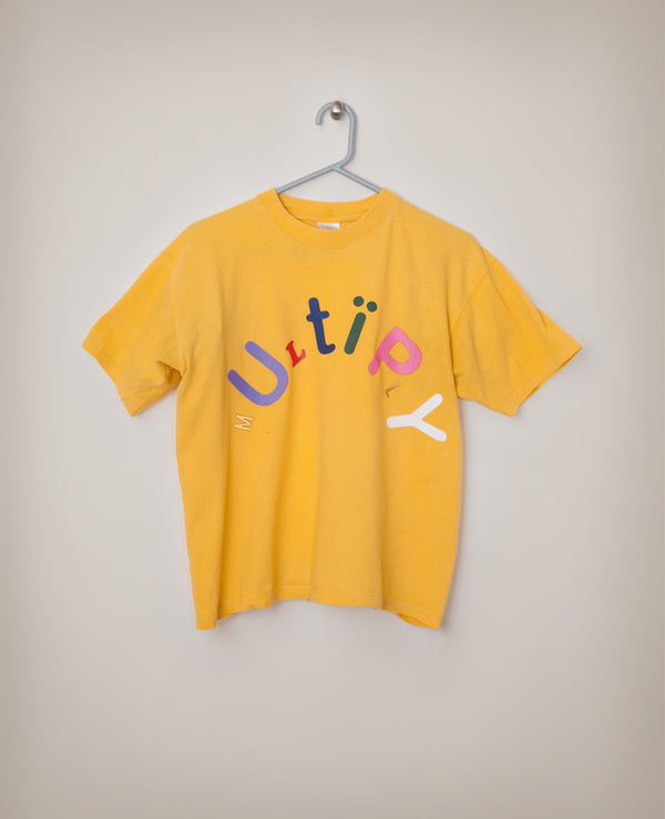 James Leonard - Yellow shirt that reads: Multiply