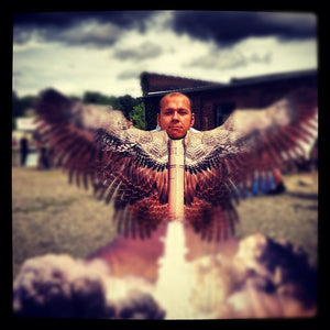 James Leonard - A stylized, moody, portrait of a man engaging with the Last Rocket Photo Stand-In. His head sits atop a winged missile as if he has been fired into the sky